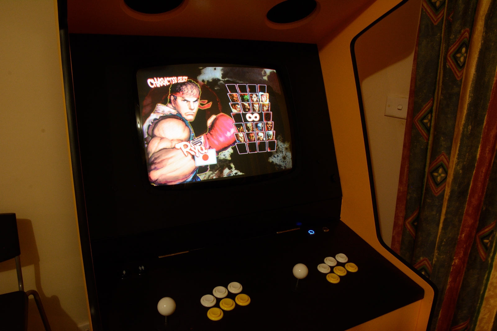 picture of the cabinet running Street Fighter IV