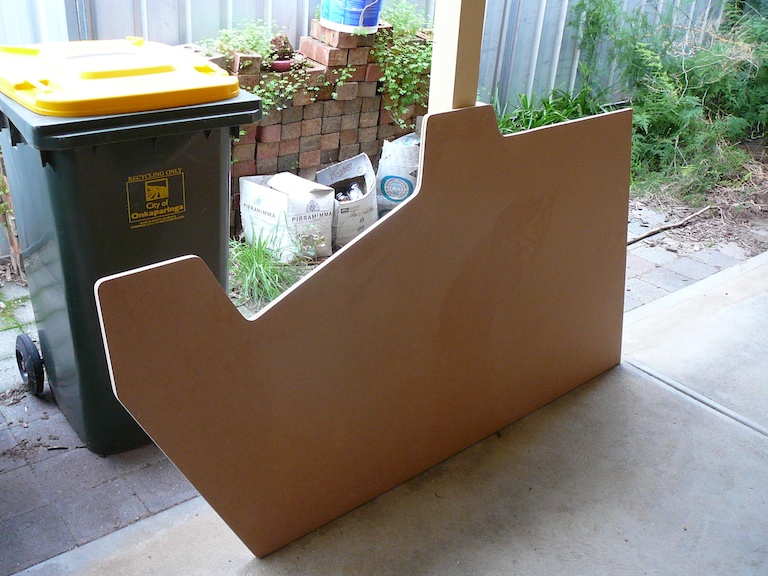 cut out side panel laying on the ground